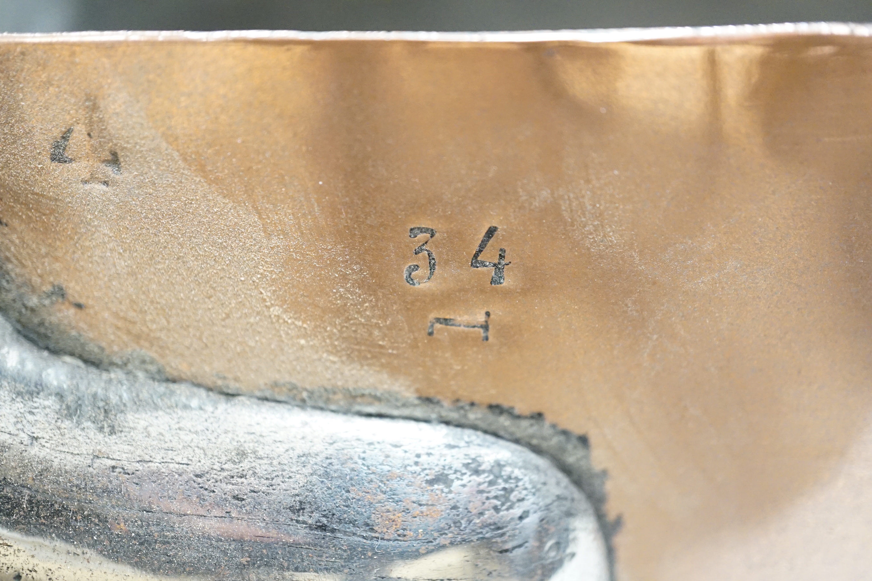Three copper pans, largest diameter 35cm